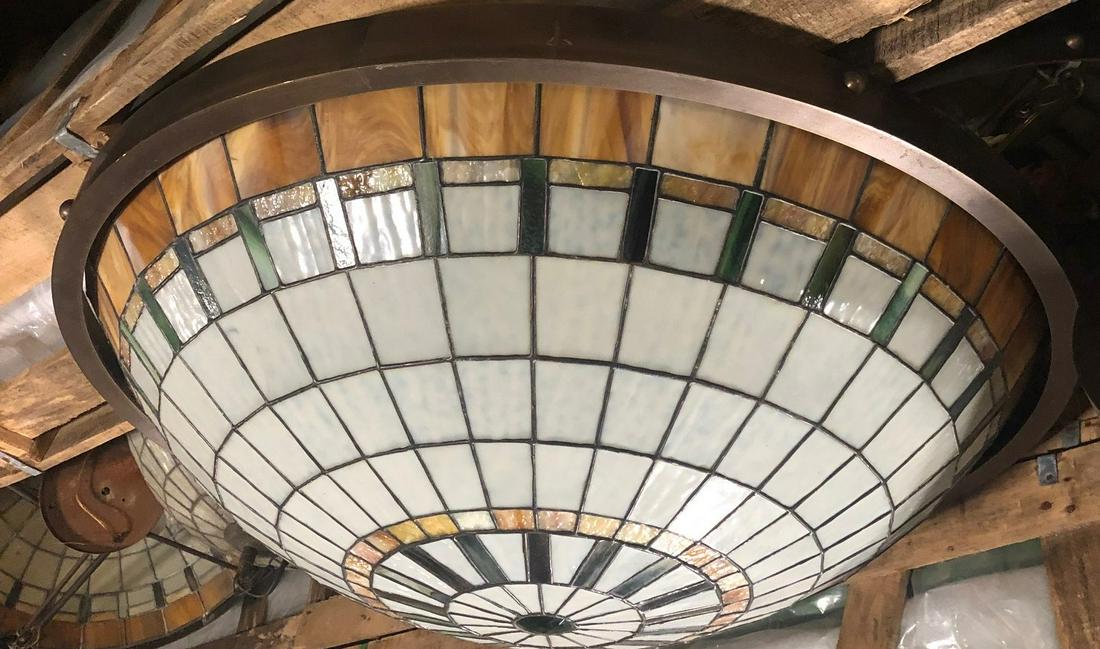 2 stained glass dome lights with bronze bands: 2 geometric design stained glass lights with bronze bands. 24" D with 18" drop
