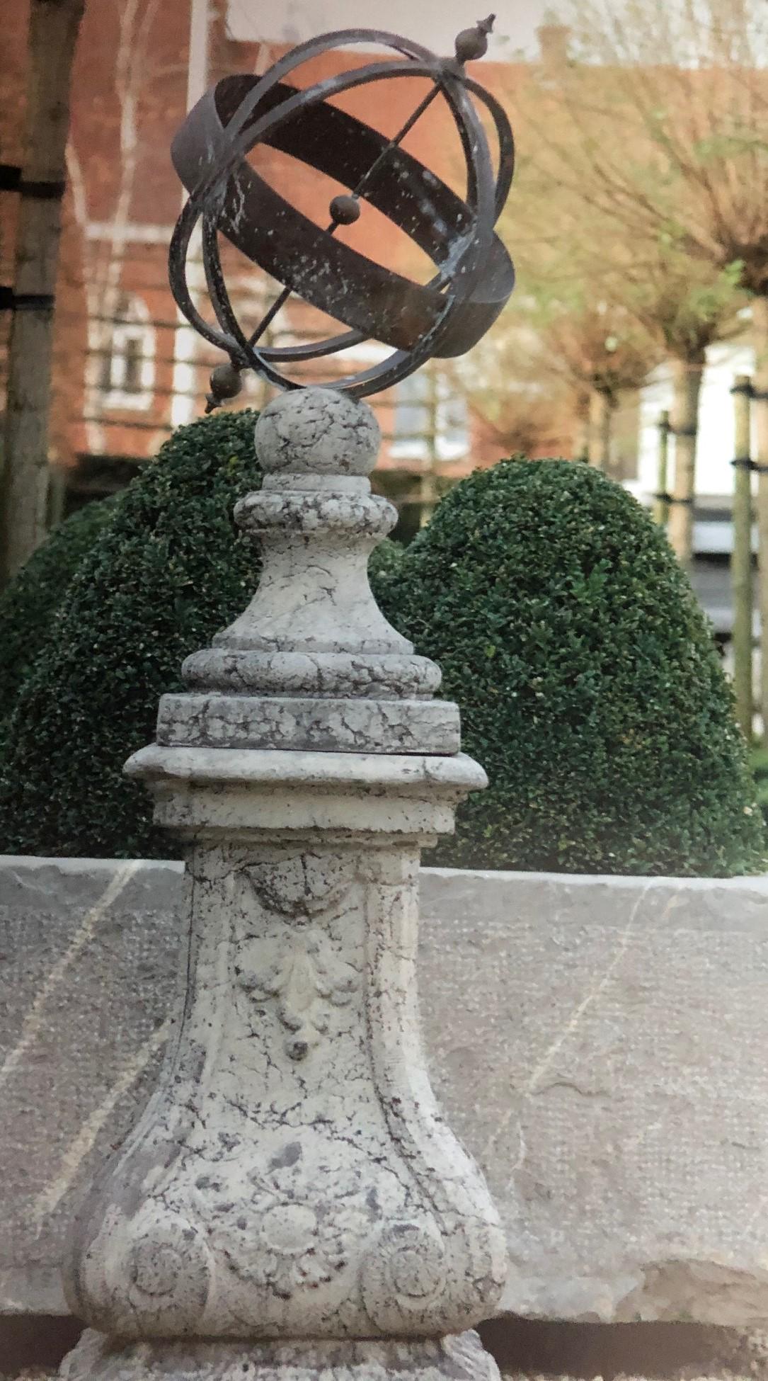 Sundial mounted on a cast composition stone base.: Sundial mounted on a cast composition stone base. 58"H 16"x16" base