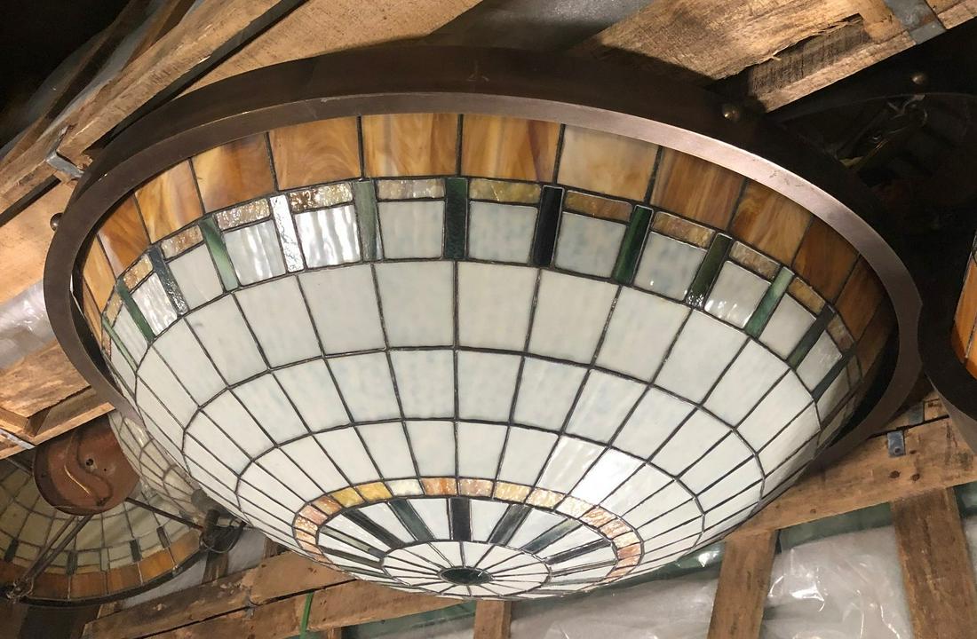 Pair of geometric stained glass ceiling dome lights: Pair of geometric stained glass ceiling dome lights with bronze band at top. 36" in diameter