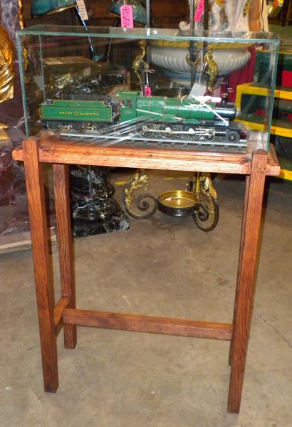 Cased English locomotive: Cased Bassett Lowke gauge 1 clockwork locomotive on tracks with wooden case; made in England, Circa 1920. 4'H x 23"W x 12"D