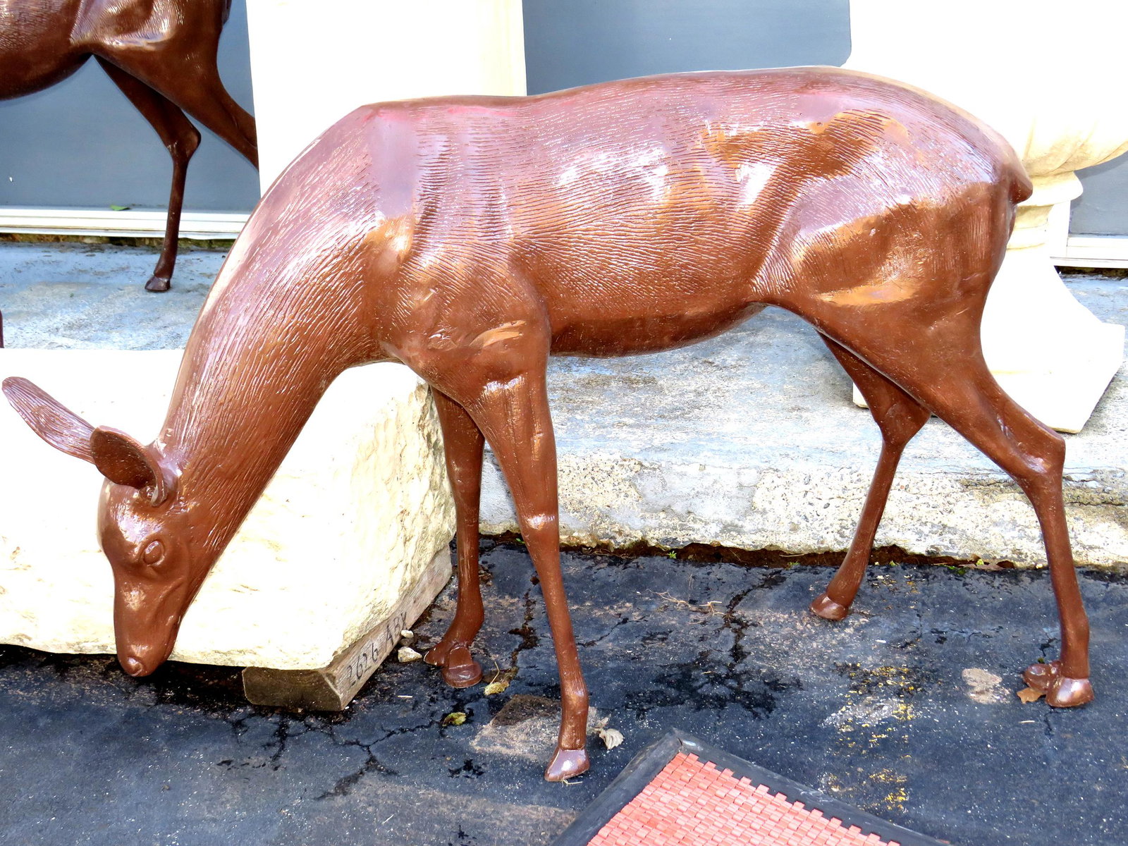 Cast Doe in Brown: Cast doe in brown 34" H x 50" W x 12" D