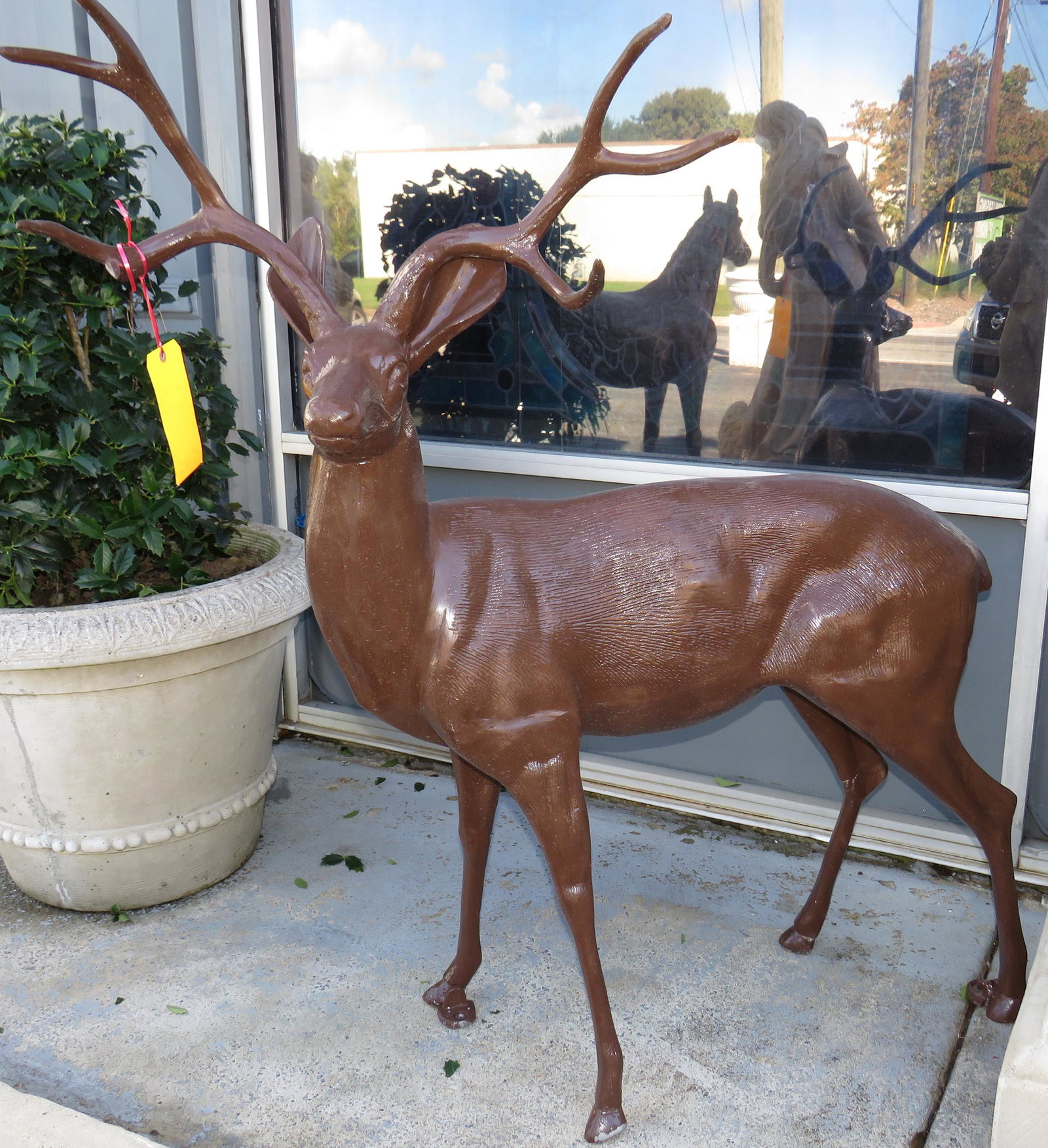 Cast Buck in Brown: Cast buck in brown 54" H x 54" W x 12" D