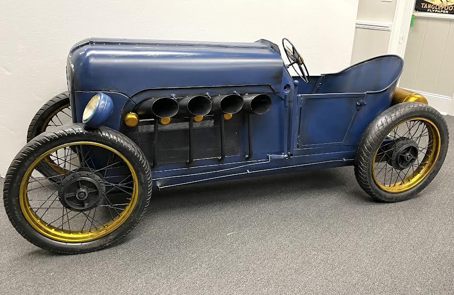 Home Wine Bar Creation in Model of Vintage Bugatti: Home wine bar creation in a model of a vintage Bugatti. Fitted bottle storate and glass racks. 36"H x 92"L x 33"H