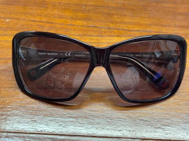 Tory Burch Sunglasses in a Gold Leather Case: Tory Burch sunglasses in a gold leather case that doubles as an evening bag.