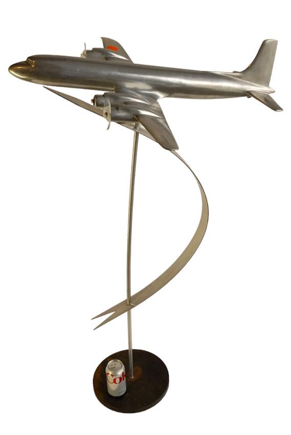 Art Deco Airplane sculpture in Chrome on stand.: Art Deco sculpture of an airplane in flight. In chrome on its stand. Circa 1930. 46"H. 30" wingtip to wingtip, nose to tail 27".