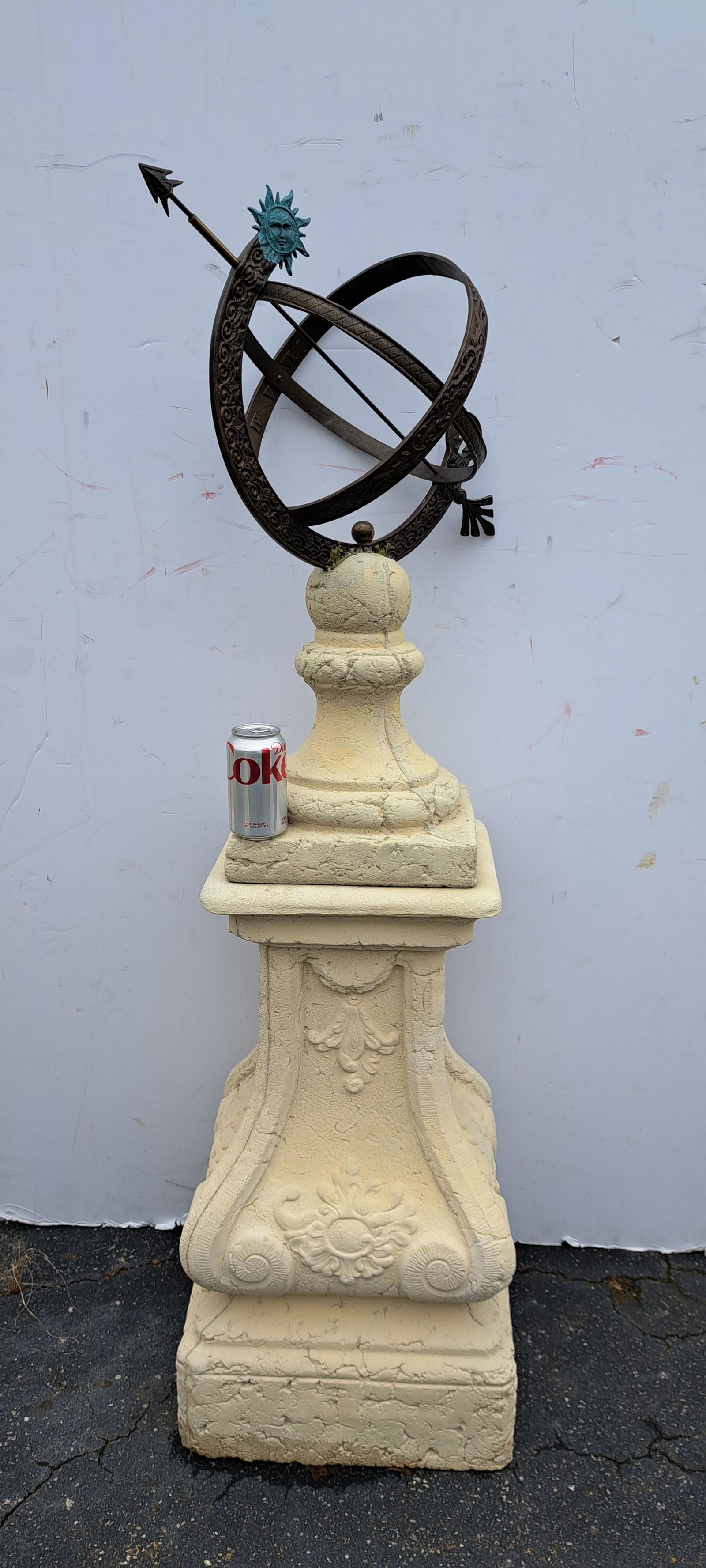 Bronze armillary sphere on Belgian cast stone base. 62"H overall.: Bronze armillary sphere on Belgian cast stone base. 62"H overall.