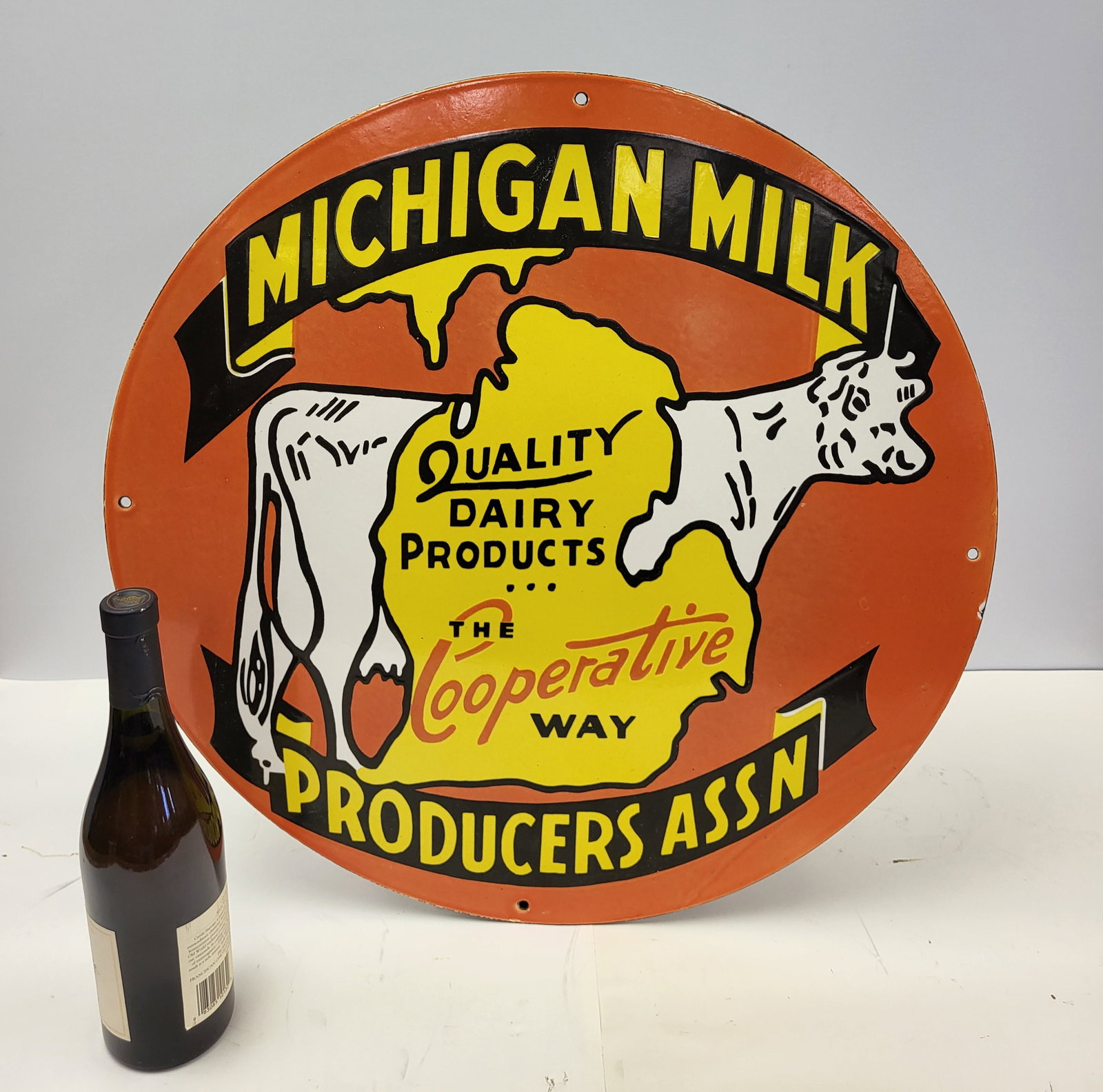Michigan Milk Round Porcelain Advertisement: Michigan Milk, Producer Association Round Porcelain advertisement sign orange white & black. 24"W