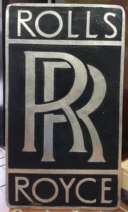 Rolls Royce Building Advertisement: Silver and black heavy cast aluminum building display advertising "Rolls Royce" back side hanging hooks set within the display. 39"H x 22"W