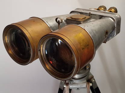 WWII Field Binoculars: Original WWII field binoculars in brass and aluminum marked Otto Krone. 62" x 35"d