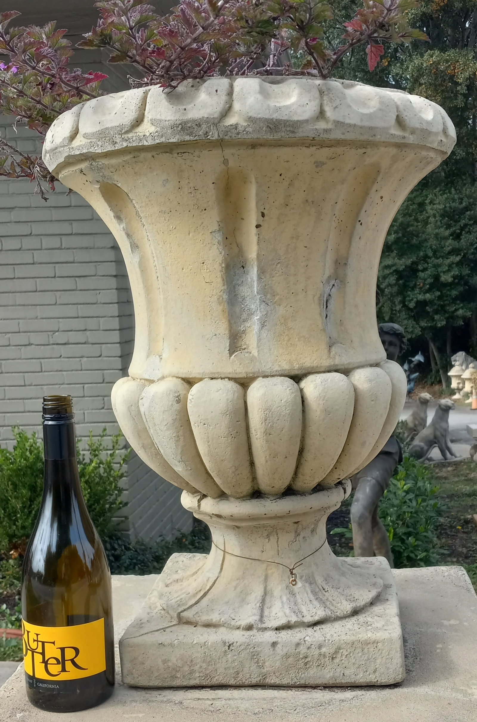 Belgium Cast Stone Fluted Urns: A pair of fluted Belgium cast stone planter urns. 23"h x 17"d