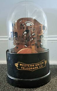 Edison Original Stock Ticker: Western union original Edison stock ticker with original base and glass top and original paper. 13.5"h x 8"w