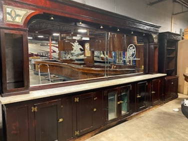 16 Foot Single Arch Back Bar: Sixteen foot mahogany single arch back bar with stained glass accents on each corner top and original brass hardware. 9' High x 16' Long