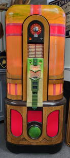 Rare Rock-Ola Commando Jukebox: A rare find and in good working condition the Commando Jukebox 1420 version. Made in 1942 and has illuminating panels and wood veneers.