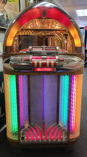 1948 Wurlitzer 1100 Jukebox: For the jukebox lover, this iconic unrestored original 1948 Wurlitzer 1100, 24-selection 78 rpm working jukebox with multicolored lights below a transparent dome displaying records. Excellent