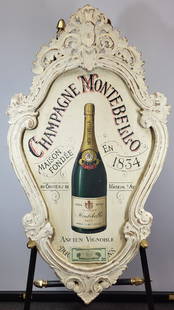 Champagne Montebello Wall Art: Hand carved white aged style frame featuring a champaign bottle with "Champagne Montebello" curved above. 46"H x 25"W