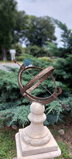 Outdoor Garden Pedestal Sundial: Stone base holding a cast iron garden ornament sundial. 62"h overall