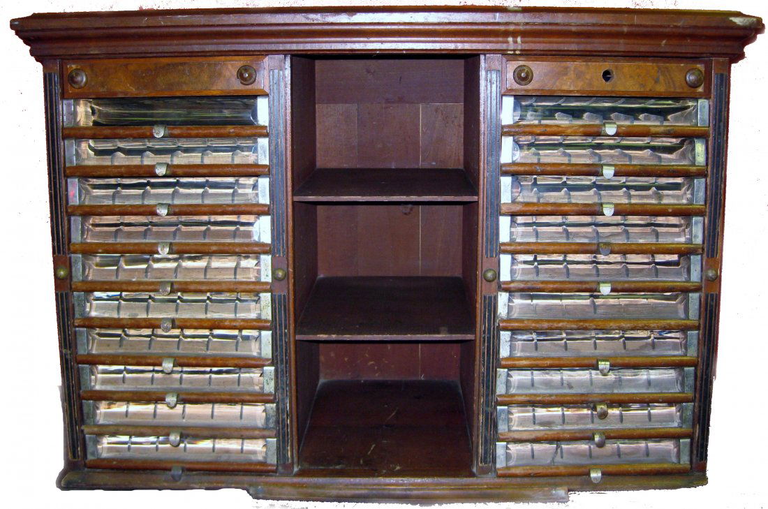 Loreland Spool Cabinet: Loreland Spool Cabinet with Original Glass. 20 drawers each holding six spools. Some scratches. Size: 24" x 34 7/8" x 16 3/4"