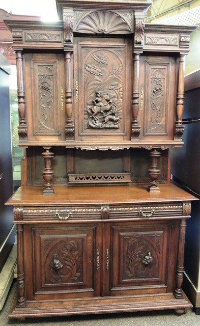 Antique Highly Hand Carved Walnut Buffet;circa 1880: Antique highly carved buffet with central hunt scene and figural masks; circa 1880. Dimensions: 86 1/2"h x 54 1/2"w x 20"d.