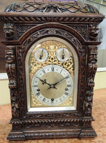 Hand Carved Bracket Clock: Hand Carved English Oak Bracket Clock; gold over bronze . Maker is Mappin & Webb, London. Overall Size: 14" W x 20" H