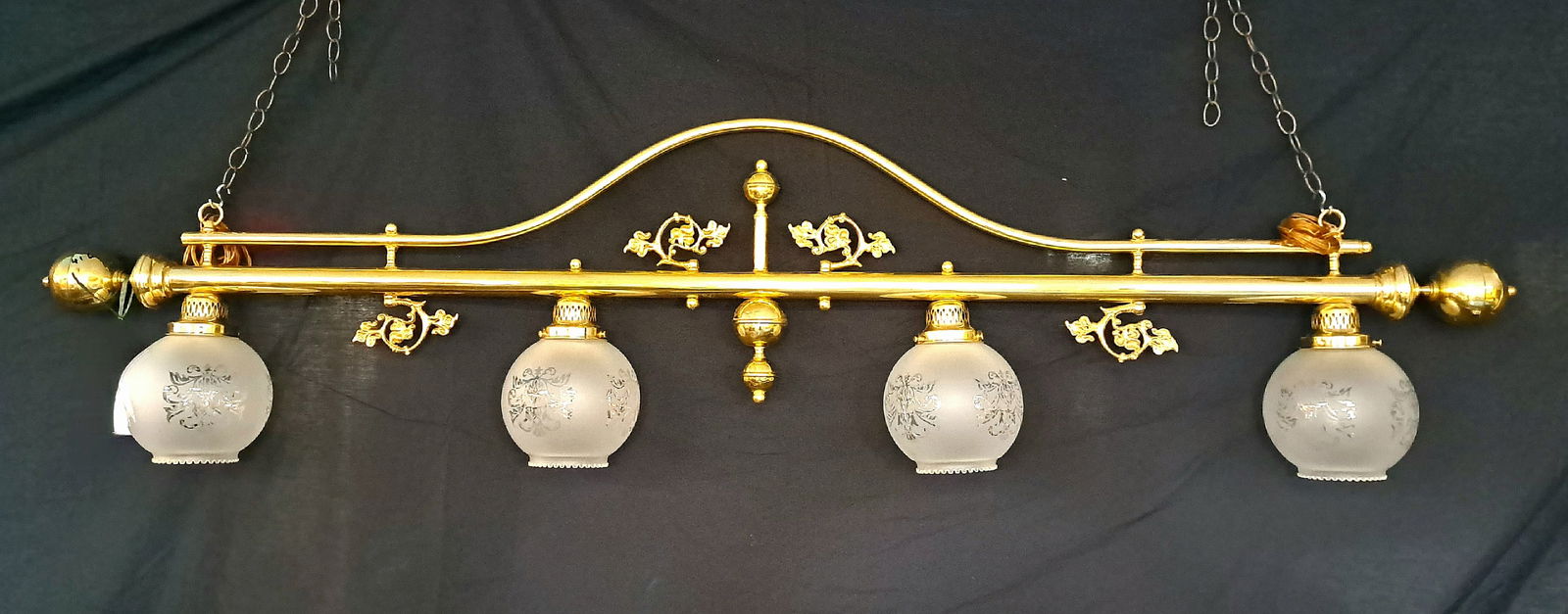 Polished Brass Hanging Light for Island: A decorative and traditional style polished brass hanging light fixture with four round glass globes. A perfect length for an island or a pool table. 40"h x 5"w x 72" long