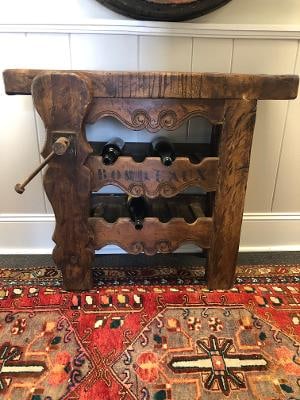 French wine console: Antique French workbench repurposed as a console with wine storage. 31"h x 38"w 22"d
