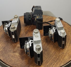 A Set Of Four Vintage Cameras