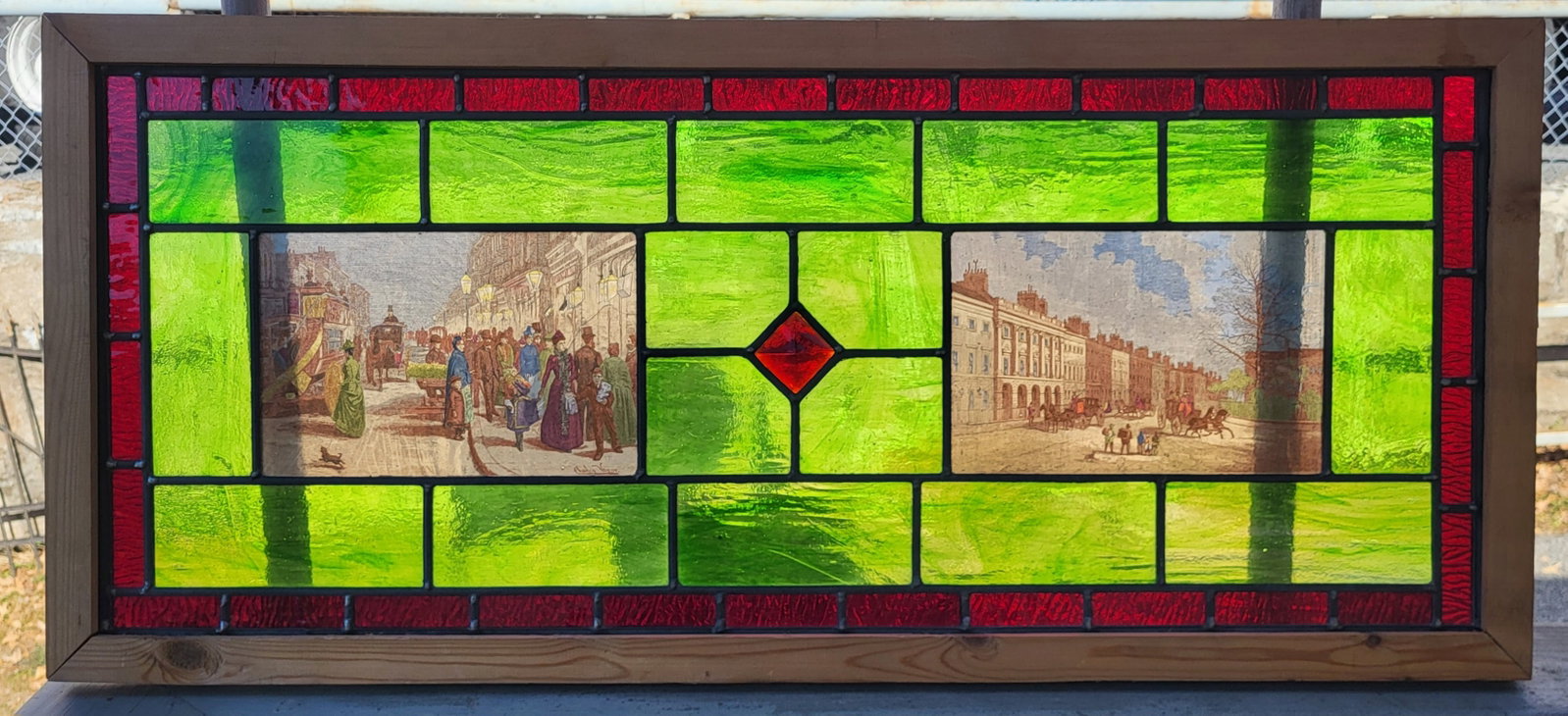 Stained glass window of English Victorian scenes: Stained glass window of English Victorian scenes framed. 15"h x 32"w