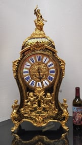 A Louis XV Style Ormolu-mounted, brass-inlaid, boulle marquetry clock