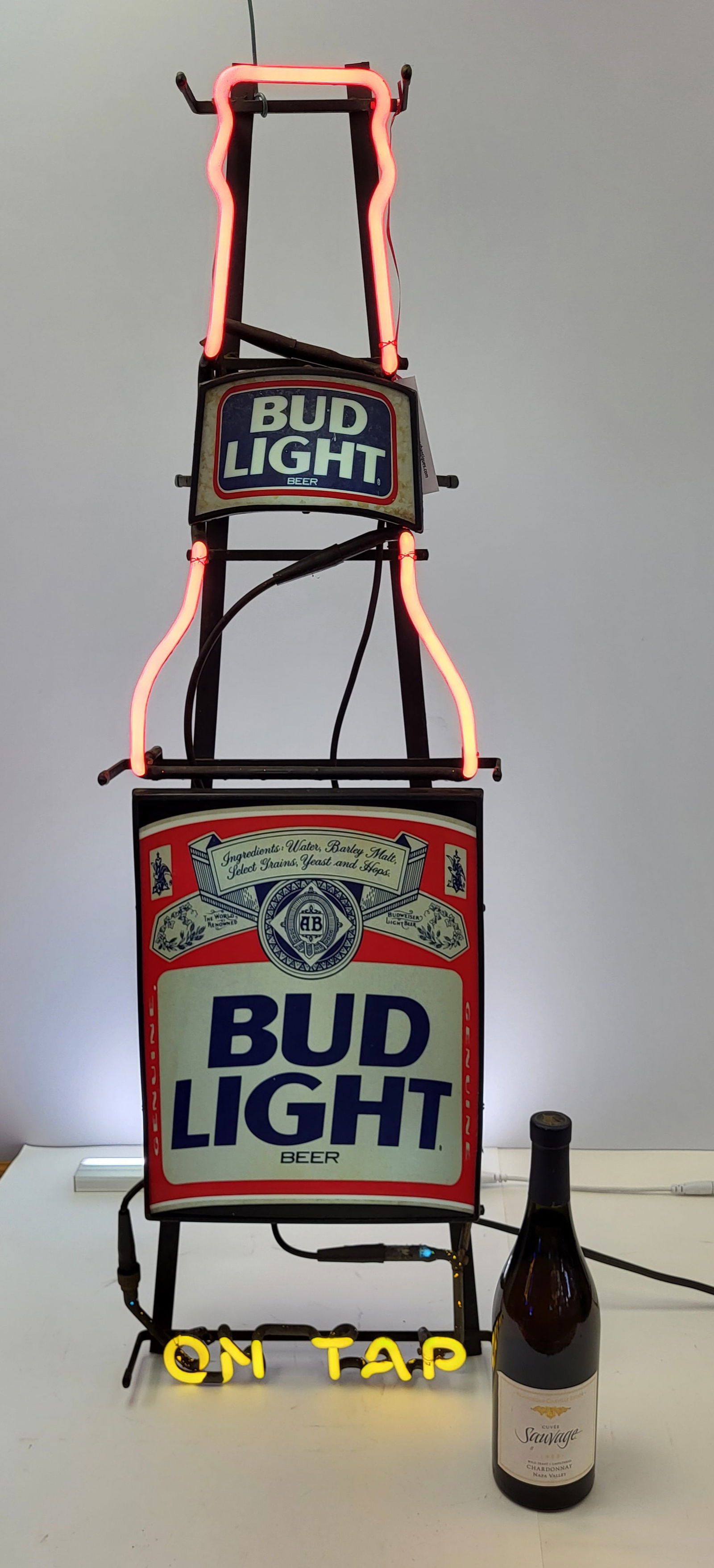 Bud Light Neon Sign. Tall Bottle Silhouette advertising available "On Tab" with glass tubing long