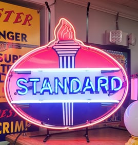 Standard Oil neon dealer sign with torch logo.