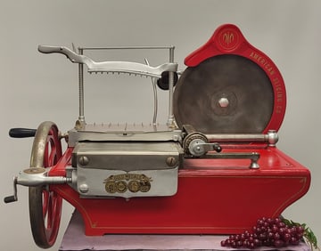 Beautifully restored deli slicing machine painted red with a 14" blade. Made by The American Slicing