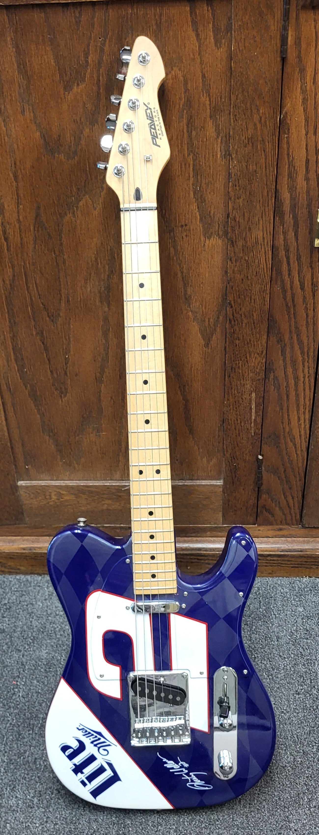 Wayne Jarrett's 1995-96 Peavey guitar autogrphed by NASCAR's Rusty Wallace. 39" L x 13" W (1 of 5)