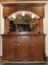 Stunning home walk up back bar in oak with arch mirror topped by lights. 92" H x 75" W x 20" D