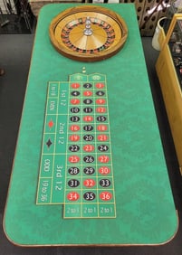 Full size casino roulette table and wheel. 34"H x 43"W x 96"D
