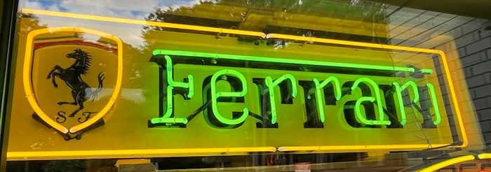 Ferrari dealer sign with neon letters spelling out FERRARI-Wired for Outside,  15"H x 58"W
