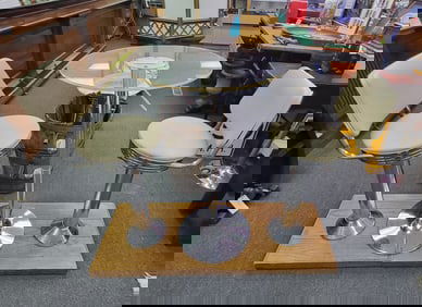 Chrome base Table and Stools, Plexiglass table top with cream leather seats mounted on classic