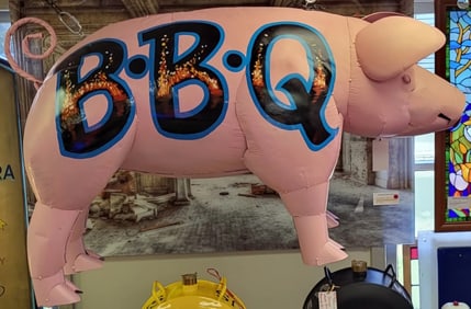 Life size metal pink pig with double sided hand painted "BBQ" letters and blue accent color 26"h x