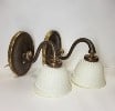 This pair has an oval base with a high curve handle flowing down to display the textured white