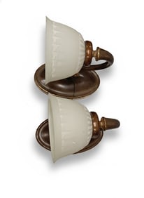 This pair has an oval base with a high curve handle flowing down to display the textured white