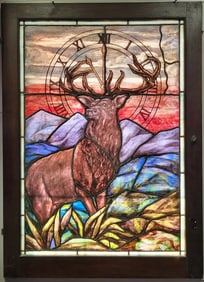 Beautiful stained glass window from the elks club featuring a majestic standing with mountains in