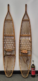 Antique hand made leather snow shoes. 55" h x 10" w