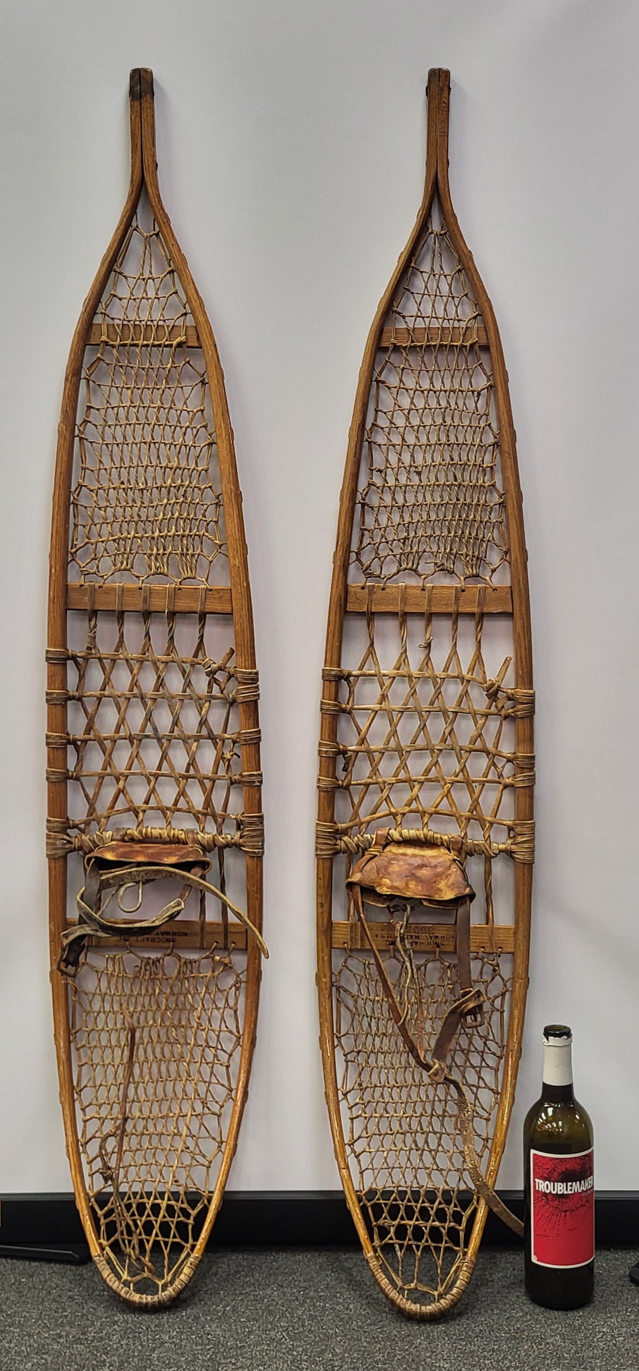 Antique hand made leather snow shoes. 55" h x 10" w (1 of 3)