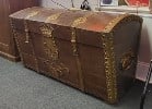English ship's trunk in oak with fancy iron bands with a bronze finish. 29" H x 52" W x 27" D