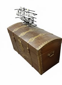 English ship's trunk in oak with fancy iron bands with a bronze finish. 29" H x 52" W x 27" D