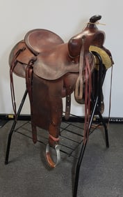 Beautiful light tan leather western saddle signed by Edward Bohliln. 41"H  x 26"W