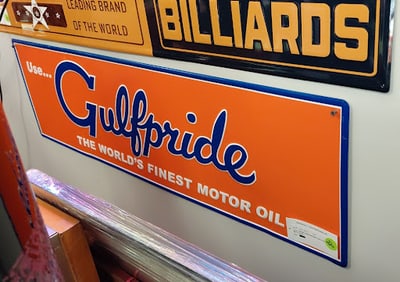 Gulfpride Sign embossed orange background with blue lettering on tin. 12" H x 42" W