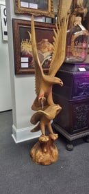 A pair or bald eagle carved in wood, one with his wings deployed, America’s greatest icons. 63" H
