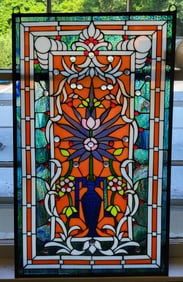 Stained glass window with flowers in a vase.Orange and violet 35"H x 21"W