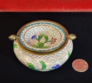 Cloisonne ashtray with light background. 2" H x 3.75" D