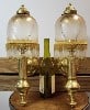 A pair of French style wall sconces with a gold base, each with 2 lights covered with a flower
